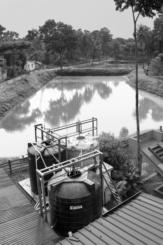 A protected pond along with part of its water treatment facility at Sulabh Safe Drinking Water plant in arsenic-affected Madhusudankati village in North 24 Parganas district, West Bengal